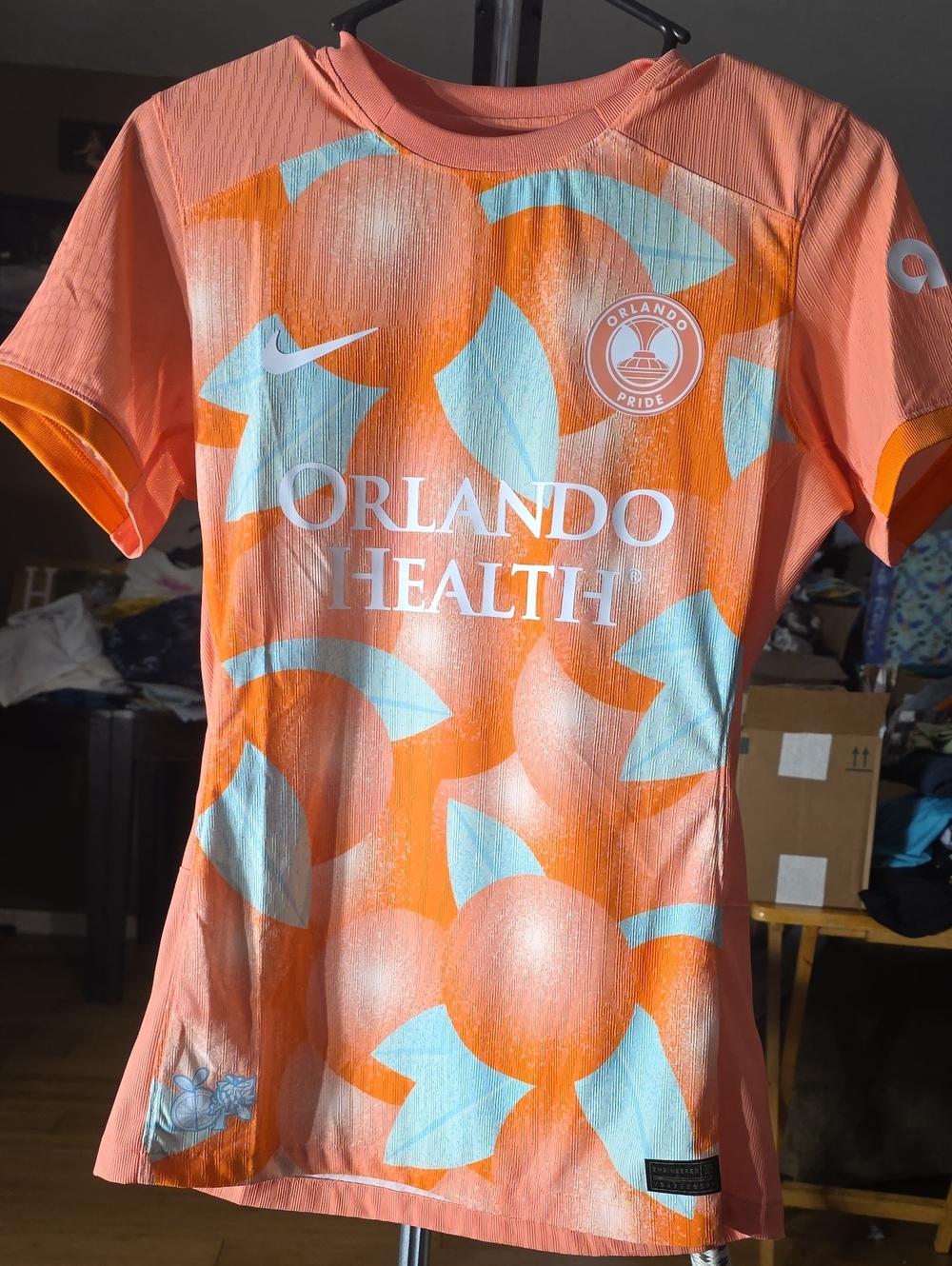 Nike Kids Peach-Orange Graphic Soccer Jersey with Light Blue Accents